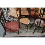 An Edwardian mahogany nursing chair; a Victorian balloon back bedroom chair; a spindle back chair.