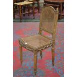 A Lois XVI style cane worked chair, arched top rail, pineapple finials, carved uprights,