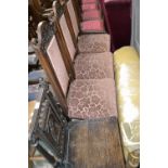 Three Victorian mahogany dining chairs carved top rail, padded back, stuffed over seat,