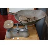 A large pair of kitchen scales,