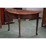 A George III mahogany demi-lune table,