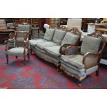 A bergere three piece suite; another chair, c.