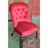 A Victorian nursing chair, button upholstered spoon back, stuffed overseat,