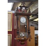A late 19th century walnut Vienna wall clock,