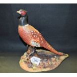 A large Royal Crown Derby model of a Pheasant, in naturalistic shades, decorated by J Lee,