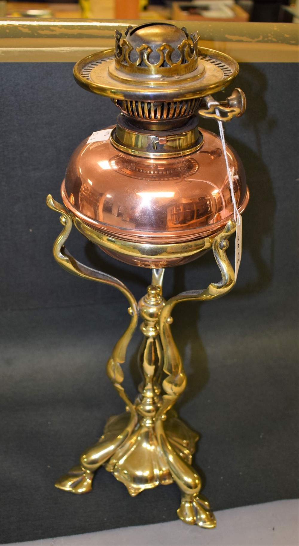 An Art Nouveau copper and brass table oil lamp, in the manner of W.A.S.