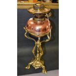 An Art Nouveau copper and brass table oil lamp, in the manner of W.A.S.