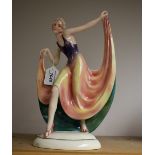 A Katzhutte pottery Art Deco figure, Dancing Girl with multi-coloured flaring dress, arms raised,