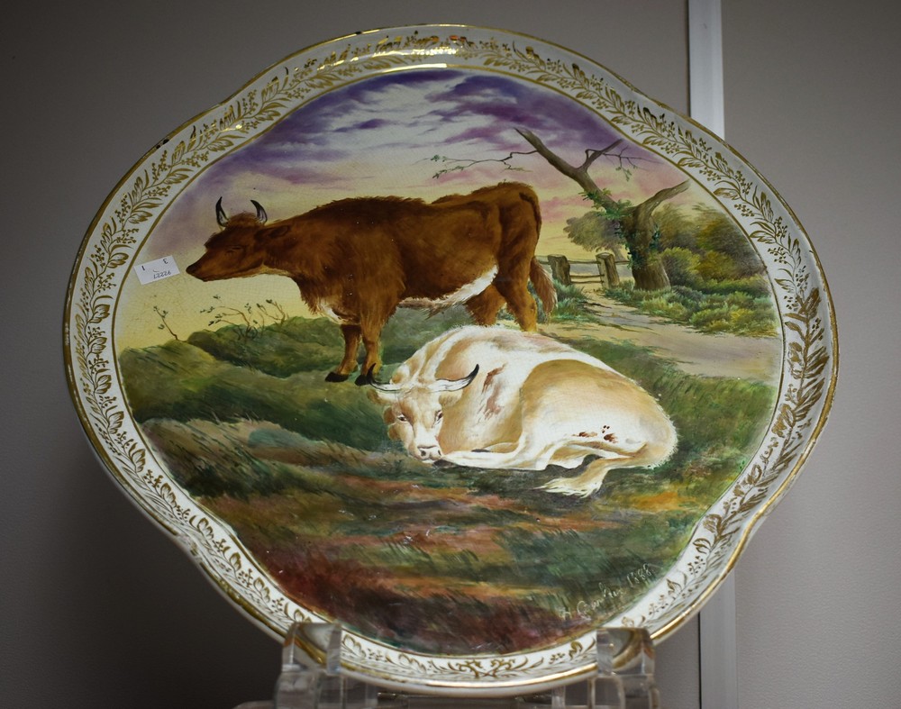 A large platter, quarter lobed, painted with cattle scene,