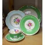 A Royal Crown Derby A300 pattern teacup, saucer and side plate, green band,