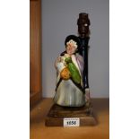 An unusual Bretby Art Pottery figural table lamp, Charles Dickens' Sairey Gamp,