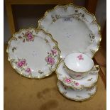 A Royal Crown Derby Royal Pinxton Roses pattern teacup and saucer; a 20cm wavy edged plate,