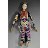 A Chinese Opera Doll, composition head and body, painted details, wooden hands and feet,