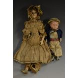 Dolls - a mid 19ct century wax headed and limbed doll, of a girl, in lace trimmed period costume,