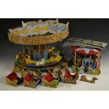 A scratch built model of a fairground ride, roundabout, dragon boat seats,