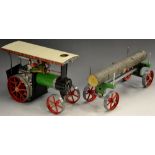 Mamod - a TE1A Steam Traction engine, green and black body, red spoked wheels,