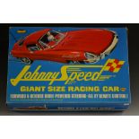 Topper toys -a Johnny Speed battery operated remote control red plastic sports car with integral