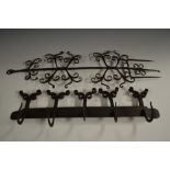A 17th century style wrought iron chateau 'game' hook, scroll cresting,