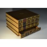 A faux leather-mounted novelty library storage box, in the form of four stacked volumes,