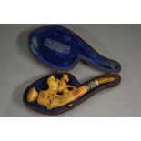 A 19th century meerschaum pipe, carved with frolicking horses, 11cm long, c.