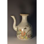 A Japanese sake ewer, painted in polychrome with a lady and a young boy,