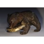 A large Black Forest carving, of a bear holding a salmon,