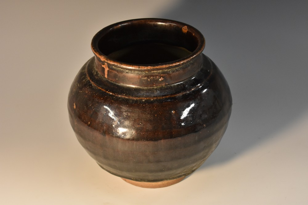 A Chinese earthenware compressed globular storage jar, thick tortoiseshell jar,