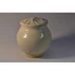 A Chinese Qingbai ware ovoid jar and cover, of small proportions, glazed in the typical palette,