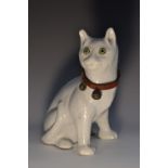 A 19th century French faience model, of a cat, seated, in the Gallé manner, green glass eyes, 21.