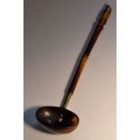 A 19th century Scottish cattle horn punch ladle, the sectional haft terminating in a whistle,