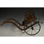 A 19th century miniature elm two-wheel dog or child's cart, arched shafts, spoked iron wheels,