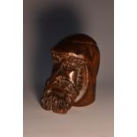 A 19th century Black Forest type novelty inkwell, carved as the head of a bearded gentleman,