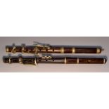 A 19th century rosewood piccolo, stamped Improved Patent, London, 29.