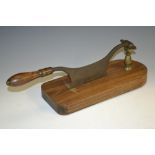 A 19th century shop counter tobacco cutter, turned handle, steel blade, brass fittings,