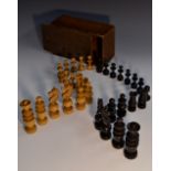 A 19th century boxwood and ebonised French Regency pattern chess set, the kings 9cm high,
