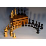 A boxwood and ebony Staunton pattern chess set, rooks and knights marked for king's side,