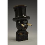A Japanese Kobe toy novelty dice shaker, as a gentleman wearing a top hat, pop-out eyes,