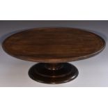 A George III Revival mahogany lazy Susan, quite plain, dished circular rotating top,