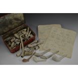 A collection of 18th and 19th century clay pipes, various forms and sizes,