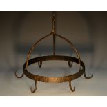 A 19th century wrought iron circular game hanger,