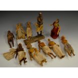 A collection of 19th century Indian softwood figures, carved, painted and in traditional dress,