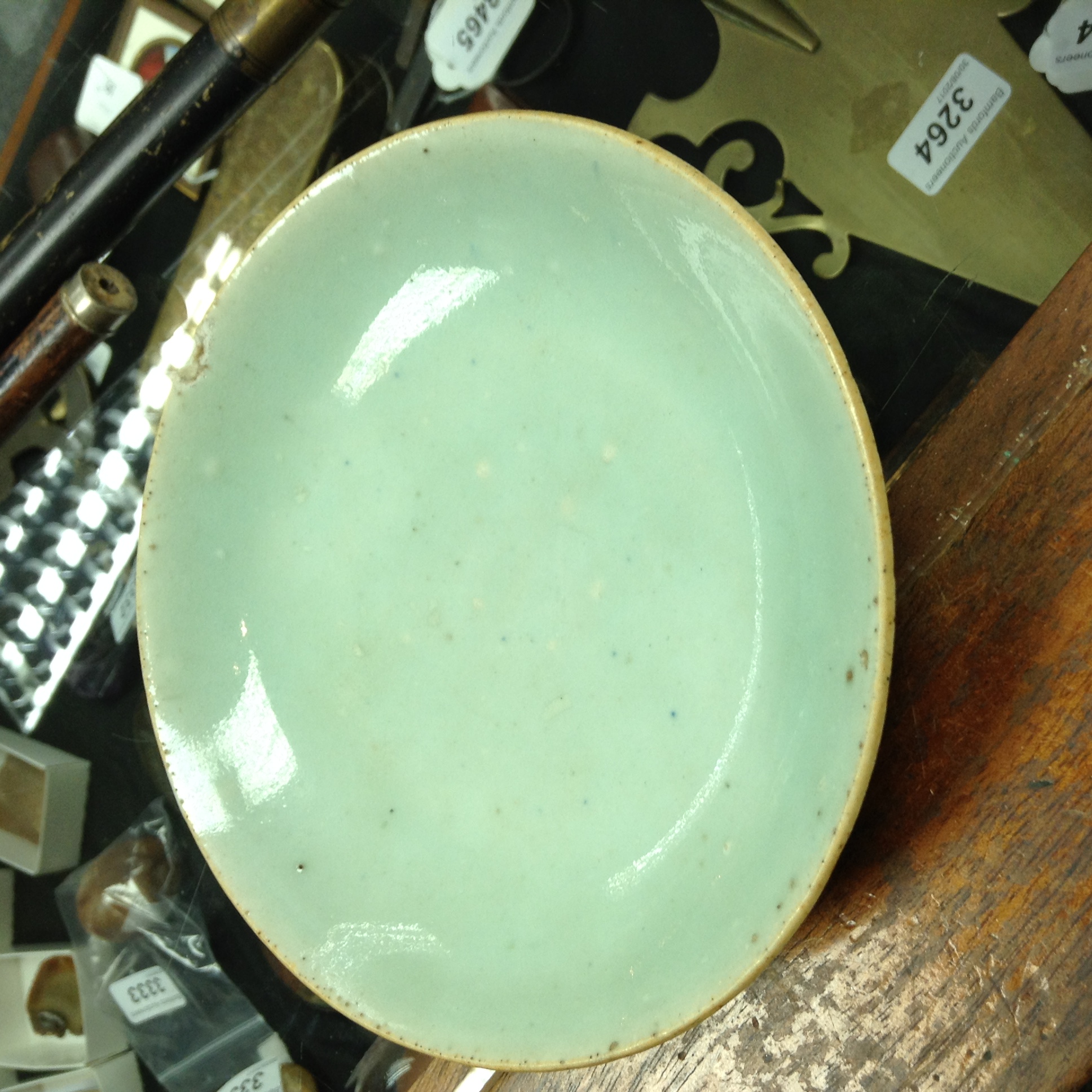 An early 18th century Japanese celadon saucer dish, - Image 2 of 4