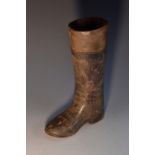 A 19th century terracotta novelty model of a boot, possibly an advertising shop display, 21cm high,