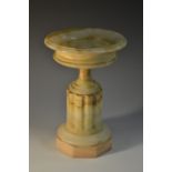 A 19th century onyx pedestal tazza, saucer-shaped dish, fluted column, octagonal base, 23.