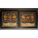 A pair of 19th century Chinese civil rank badges, embroidered in coloured threads with phoenix,
