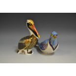 A Royal Crown Derby paperweight Penguin and Chick, gold stopper; another,