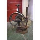 A vintage cast iron hand cranked pillar drill