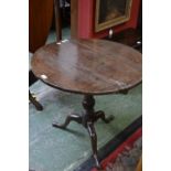 A George III oak tilt top table circa 1810.