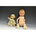 Dolls - an early 20th century open mouth doll; another,