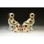 A pair of Victorian Staffordshire dogs, loose front legs, copper lustre patch markings, c.